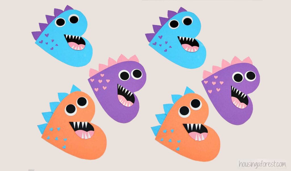 funny dinosaurs shaped like hearts made out of colorful construction paper